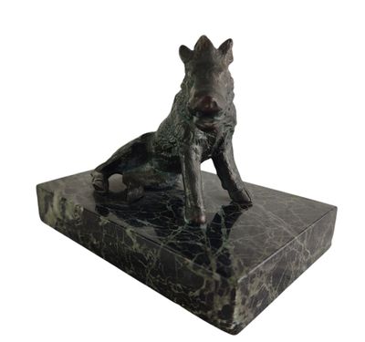 statue of a dog sitting on a marble base on a white background