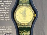 a green and yellow watch on display in a display case