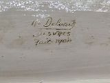 a close up of a white vase with writing on it