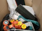 a cardboard box filled with assorted items in it