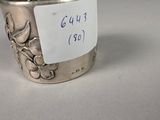a silver cup with a note on the side of it