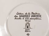 a white plate with a picture of a woman on it
