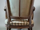 an image of a chair with a stripped seat and back