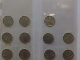 a lot of coins that are in a plastic case