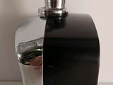 a black and silver bottle with a silver lid
