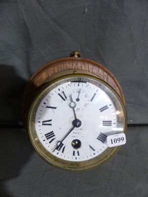 a wooden clock with roman numerals on the face