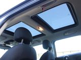 a view of the sunroof from inside of a car