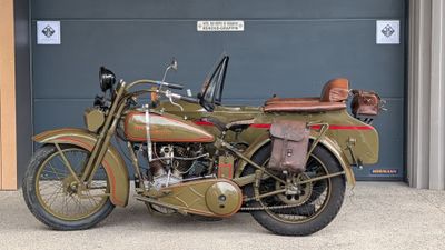 motorcycle parked in front of a garage door in front of a garage door