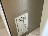 a picture of a stainless steel toilet in a bathroom