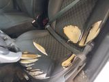 a car seat with holes in the back of it