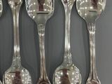 a lot of spoons that are sitting on a table