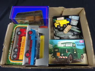 a box with a bunch of toy vehicles in it