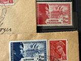 several stamps on a piece of brown paper with writing on them