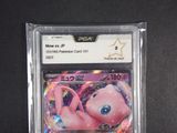 an image of a pink pokemon card in a plastic case