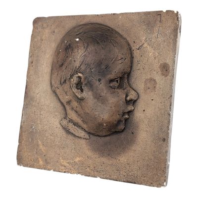 an image of a clay sculpture of a baby ' s head