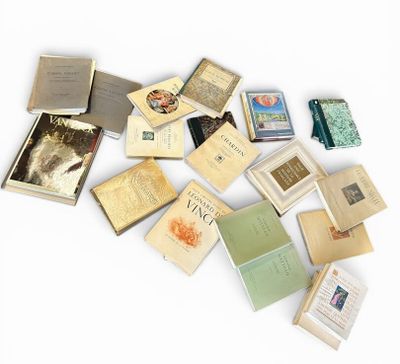 a lot of books that are laying on a table