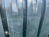 a close up of a metal pipe with a sign on it