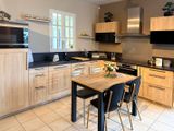 a kitchen with a table and chairs in it