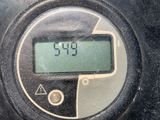 a close up of a digital clock on the side of a car