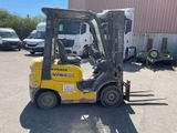 a forklift truck that is parked in a parking lot