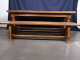 a wooden bench that is sitting in front of a blue curtain