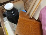 a box full of books and other items on a table