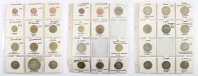 several different types of coins are displayed in a display case