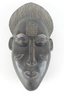 an image of a metal mask on a white background