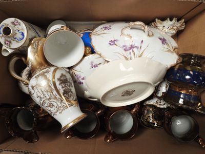 a box filled with many different types of tea cups and saucers