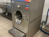 a machine that is sitting in a kitchen next to a counter