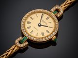 une montre pour femme sertie de diamants et d'émeraudes