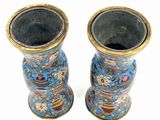 two vases that are sitting next to each other on a table
