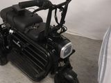 a scooter that is sitting in the corner of a room