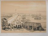 an old picture of a group of people standing on top of a beach next to a body of water