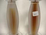two vases that are sitting next to each other on a table