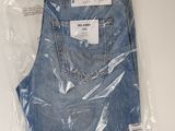 the back of a pair of blue jeans wrapped in plastic