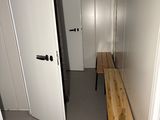 a long wooden bench in the hallway of a house