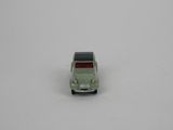 a small toy car that is sitting on a white surface