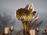 a chandelier that has a flower design on it