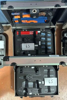 a lot of tools in a case on the floor
