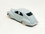 a toy car that is sitting on a white surface