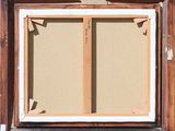 an image of a picture frame with a picture hanging on the wall