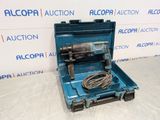 a blue tool box with a cord in it sitting on a table