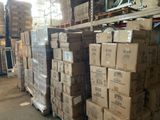 many boxes stacked on top of each other in a warehouse