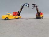 two toy trucks that are sitting next to each other