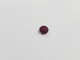 an oval shaped red ruby stone on a white surface