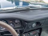 a dashboard of a car with a steering wheel and a dash board