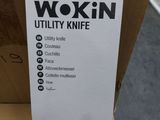 a box of wokin utility knife sitting on a table