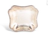an antique silver plate on a white background with a white background