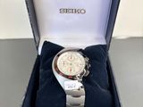 the watch is in a box on the table ready to be worn